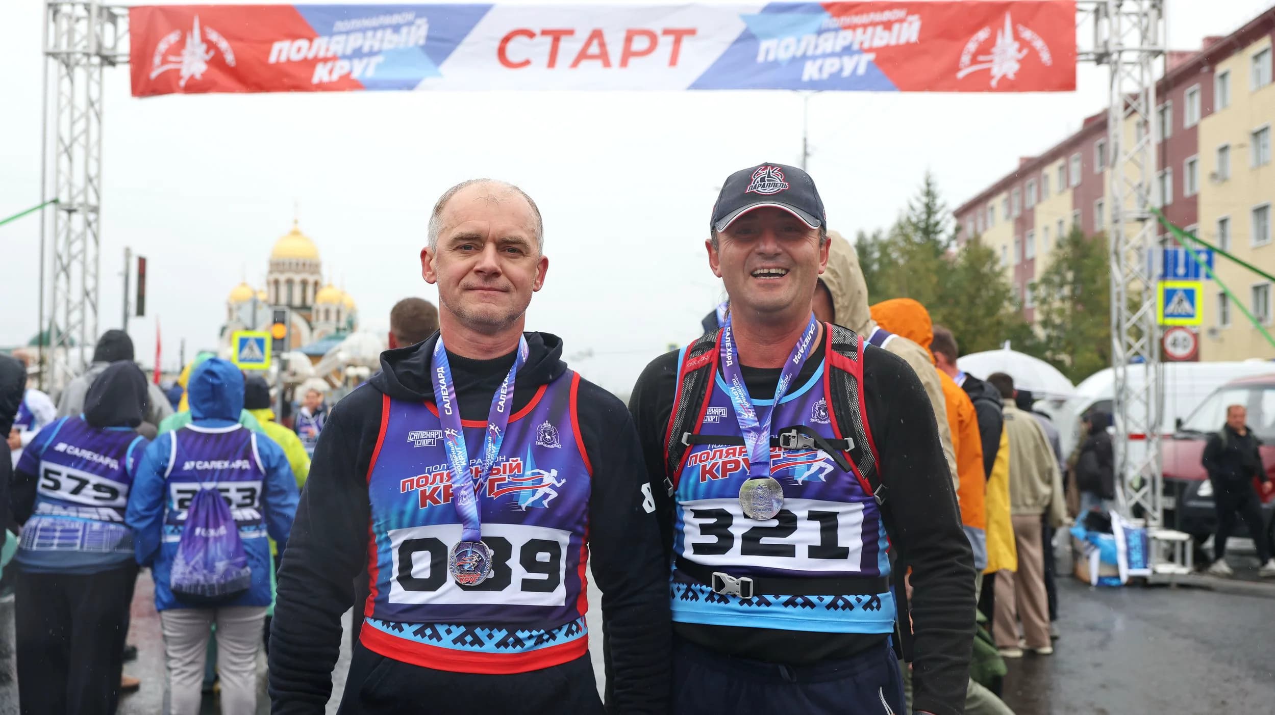 Алексей Титовский с медалью финишера